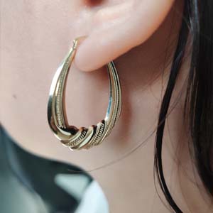 graduated puffy oval twist hoop earring in fdrc11071 fancy1 nl yg