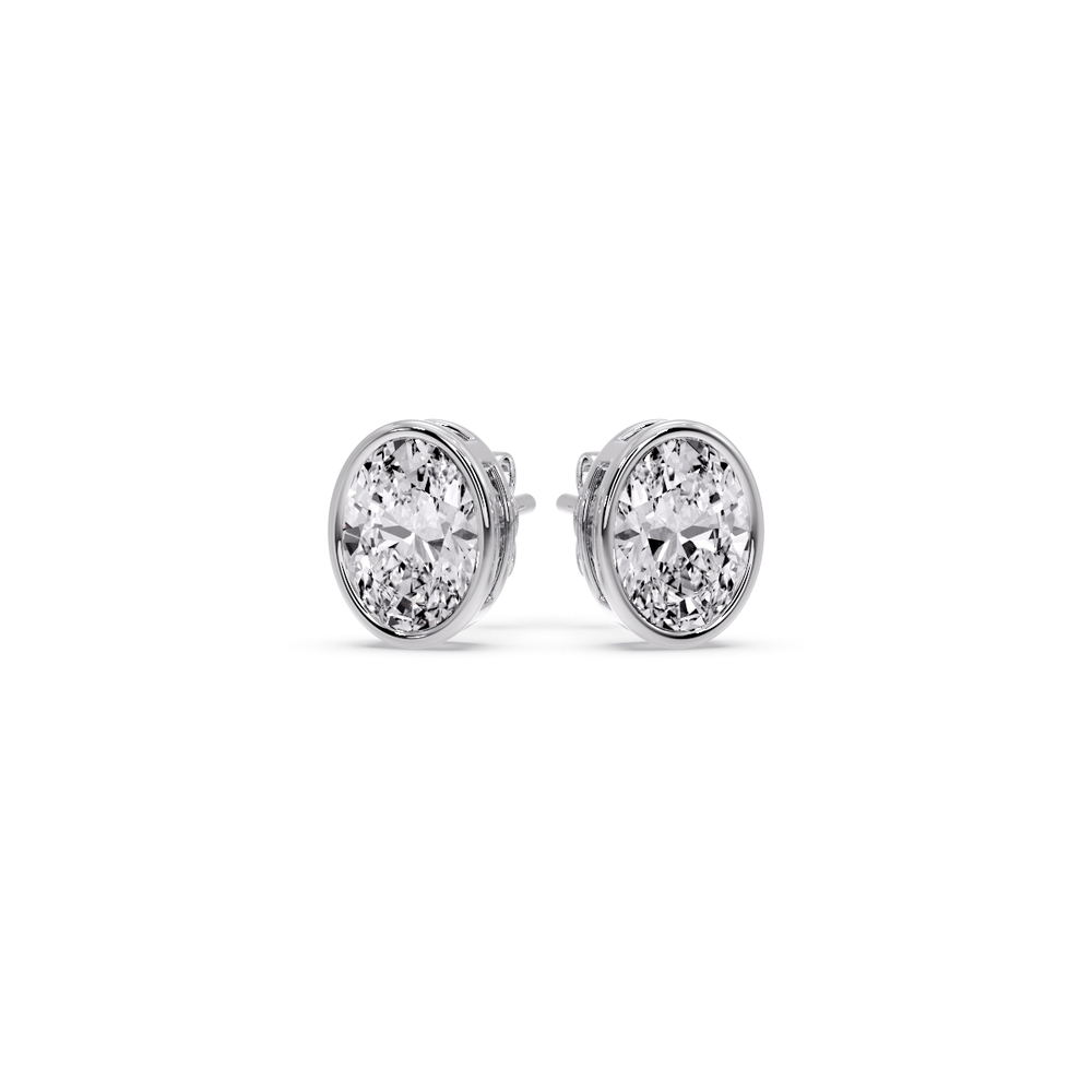 0.75 Ct. Oval Shaped Diamond Bezel Stud Earring with 14K White Gold White Diamond