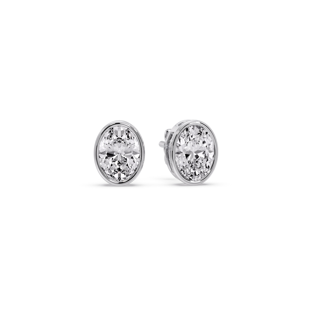 0.75 Ct. Oval Shaped Diamond Bezel Stud Earring with 14K White Gold White Diamond