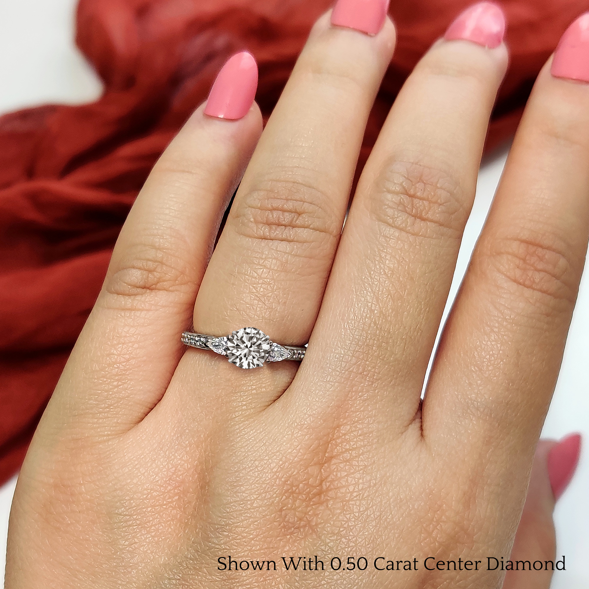 14k White Gold 3-Stone Round and Pear Moissanite Engagement Ring 14k White Gold 3-Stone Round and Pear Moissanite Engagement Ring