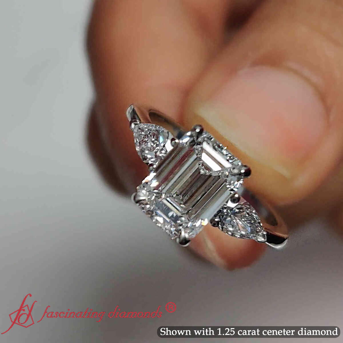1.50 Ct. Pear Accent 3 Stone Emerald Cut Ring with 14K White Gold White Diamond