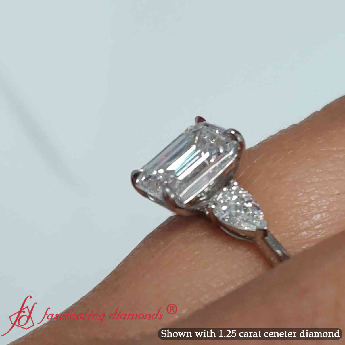 1.50 Ct. Pear Accent 3 Stone Emerald Cut Ring with 14K White Gold White Diamond