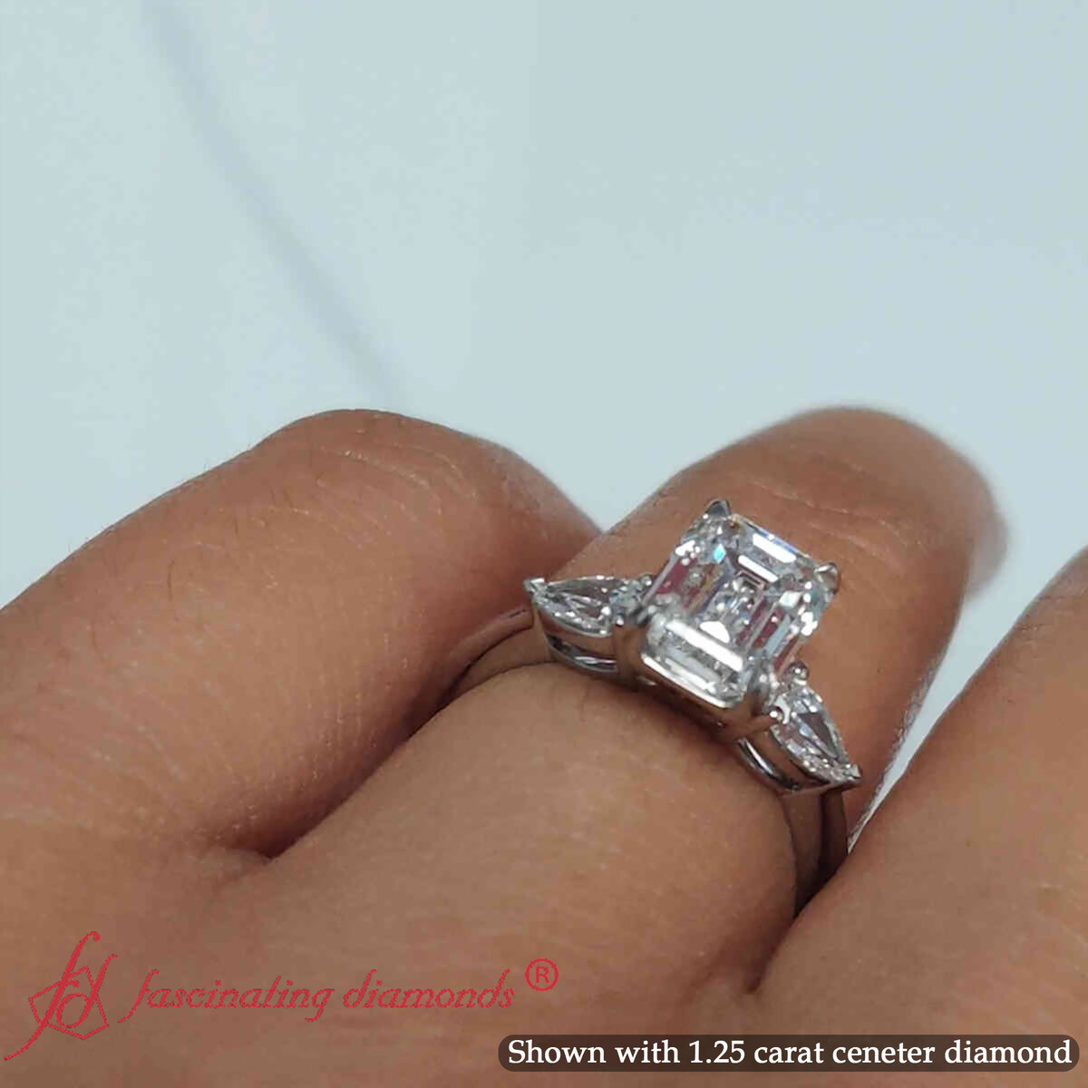 1.50 Ct. Pear Accent 3 Stone Emerald Cut Ring with 14K White Gold White Diamond