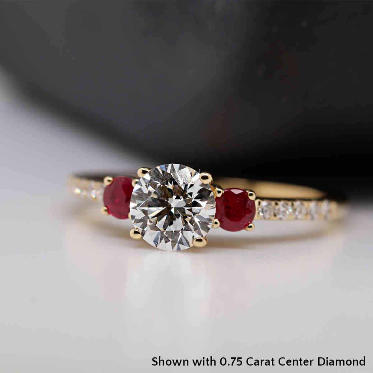 0.75 Carat Round Cut Three Stone Ring with 18K Yellow Gold Red Ruby